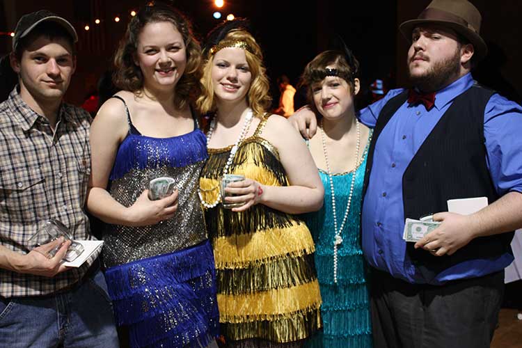 Giggling gals with glittery gams go gambling with gregarious gangsters for the 35th Annual Casino Night
