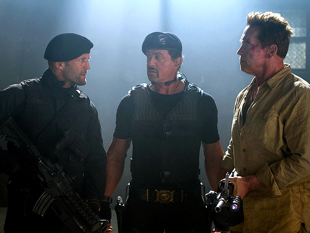 Jason Statham, Sylvester Stallone, and Arnold Schwarzenegger in The Expendables 2.