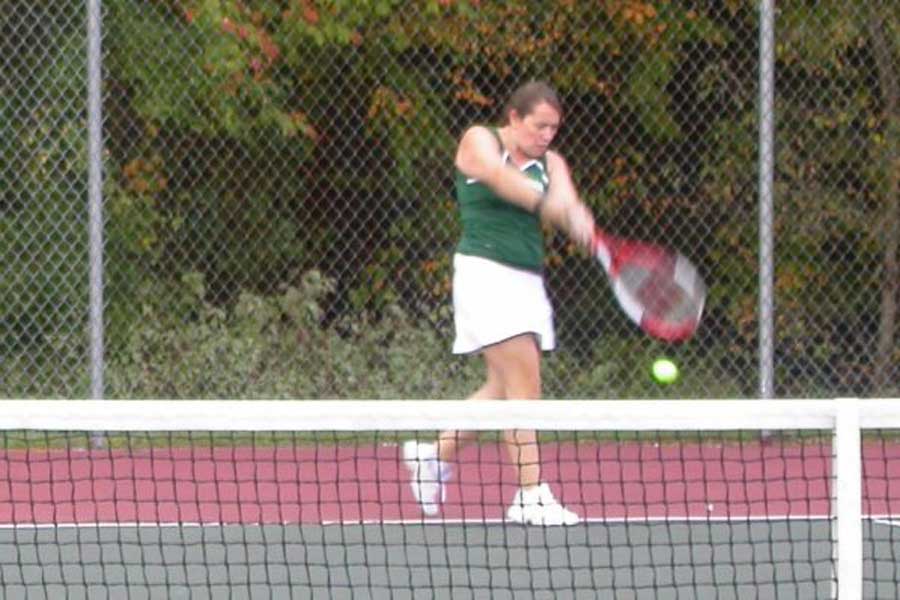 Meagan Ploof swings a backhand