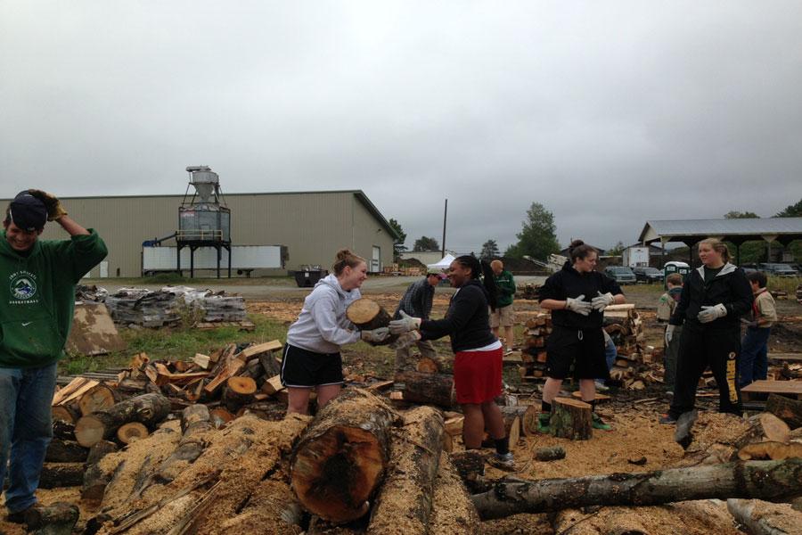 JSC and local community members move and stack wood for the United Way of Lamoille County Firewood Project as part of the college’s “SERVE Local” program, which sponsors local service opportunities during the academic year. 