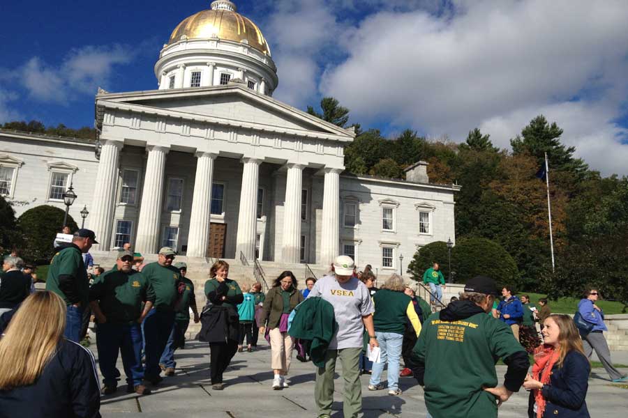 Vermont State Employee Association union members gather at the State House