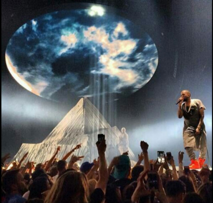 Kanye West on stage during one performance in his Yeezus Tour