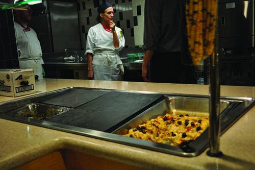 Peggy Edwards behind the vegan station in the Stearns Cafeteria