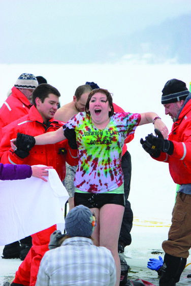 JSC student Amanda Rae Bolduc catches her breath as Johnson Water Rescue helps her out of the icy water