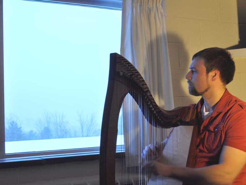 Jeff Ketcham relaxes with his harp