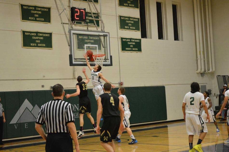 Bryan Hickey blocks Dan Fleming in game against Husson