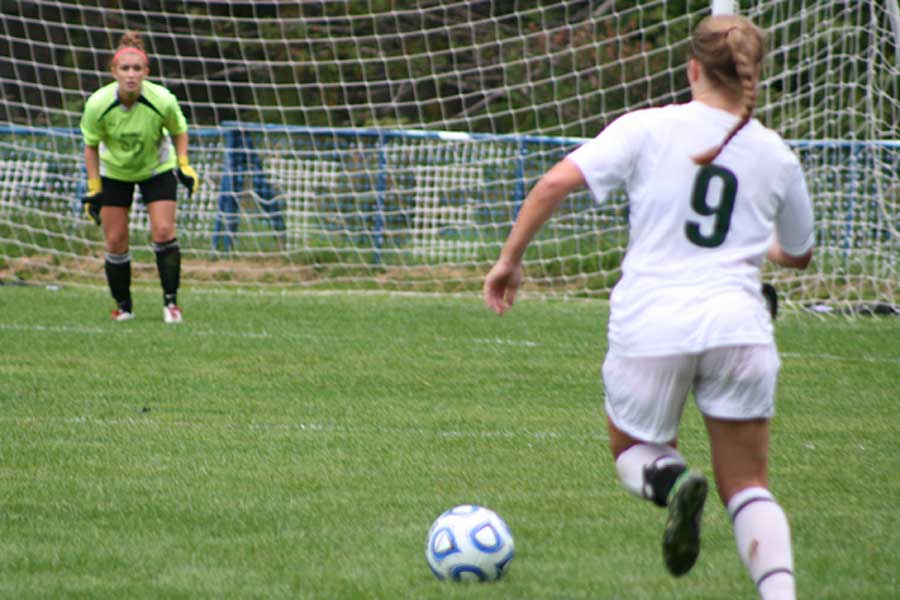 Kylie Aither goes for a goal