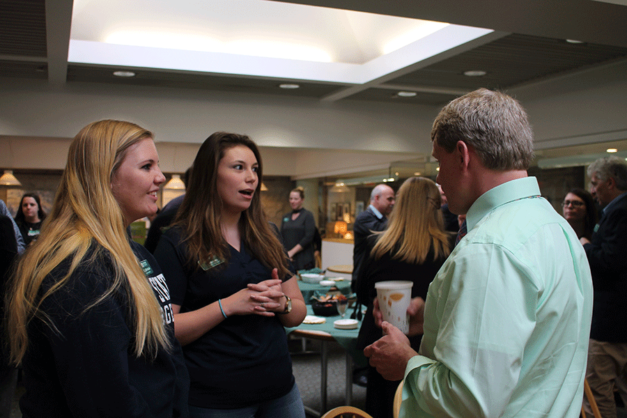 Colleen Hagan and Gabbi King talk to Jonathan Davis, who will be NVU’s dean of  students