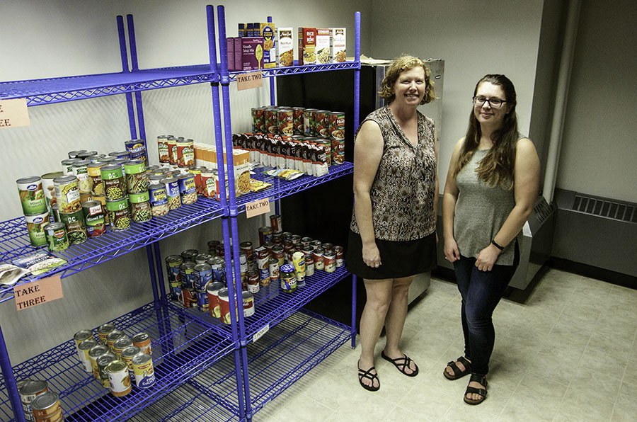 Krista+Swahn+and+Shavonna+Bent+in+the+food+pantry