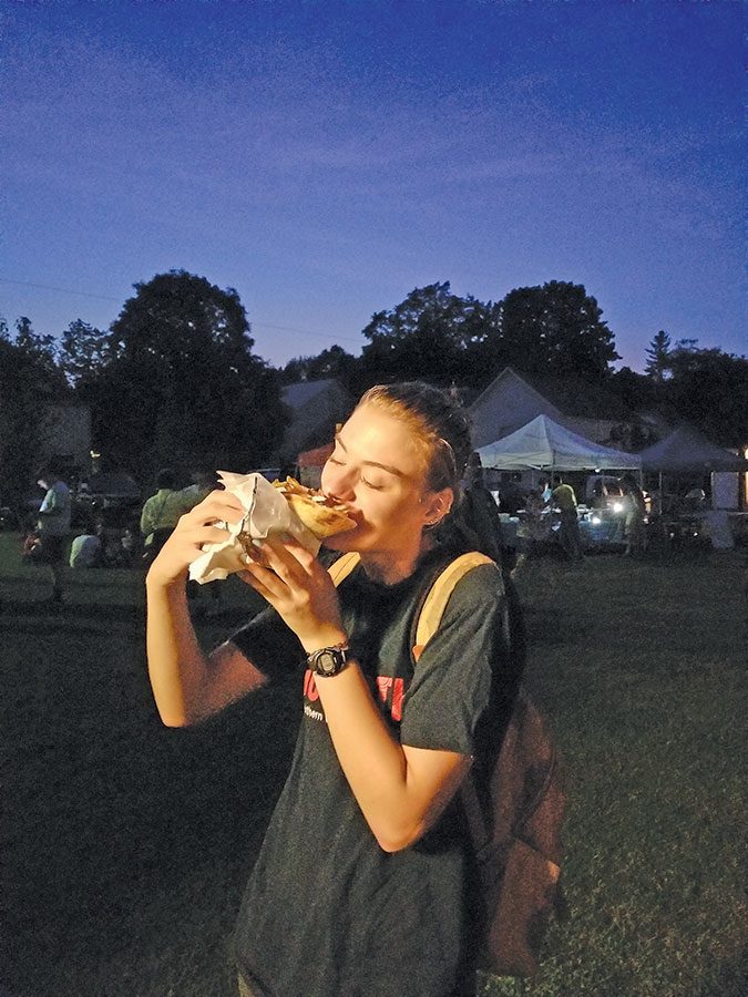 The reporter thoroughly investigates the falafel for its culinary integrity