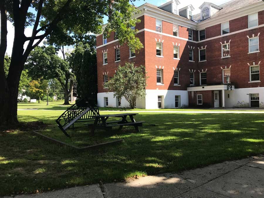 The now-empty Moses Hall held a coffee house, bike shop and students, as a residence hall.