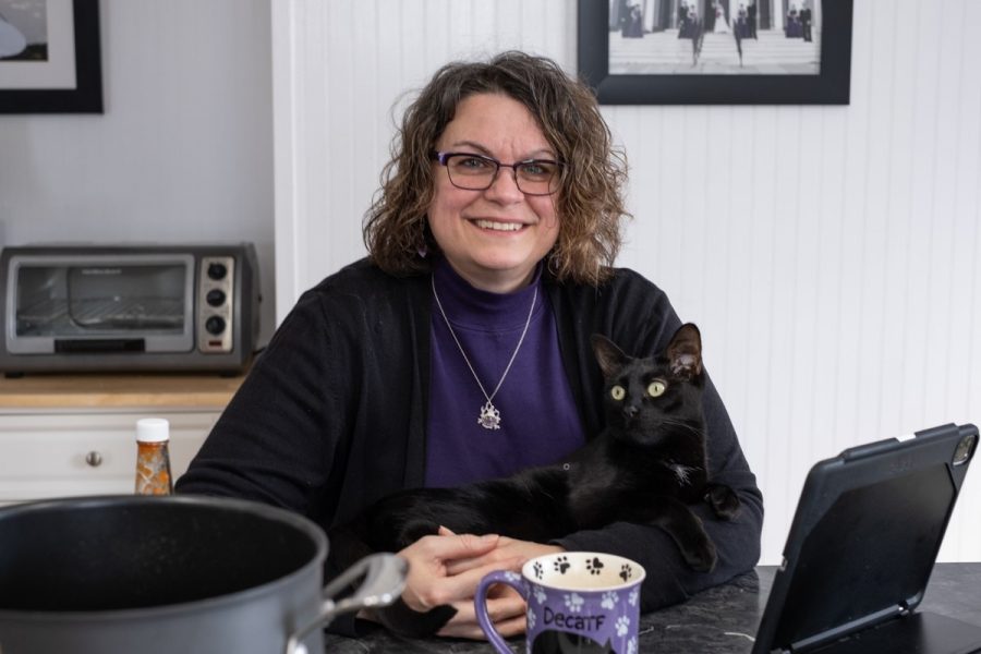 Julie Theoret and her little fur baby hard at work