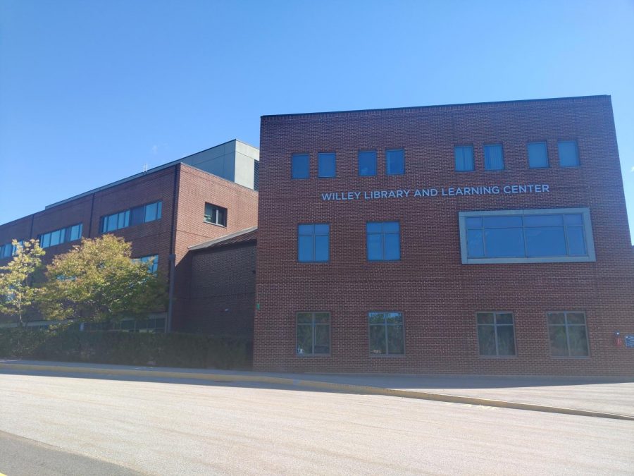 The windows of the Willey Library building near the Bentley parking lot