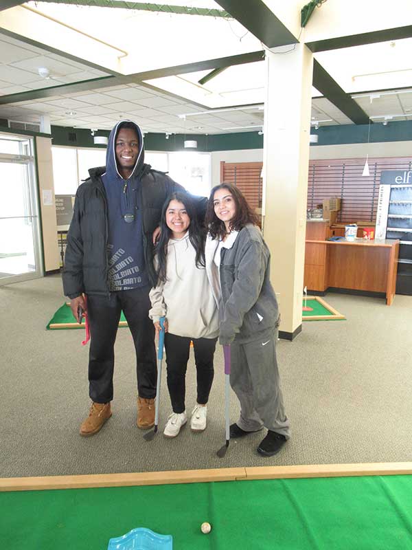 Malik Moore, Ari Bunney and Denyse Ruiz after a grueling round of miniature golf in the former 
bookstore