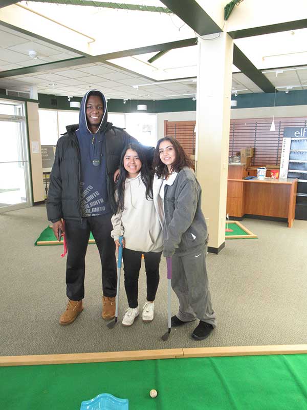Malik Moore, Ari Bunney and Denyse Ruiz after a grueling round of miniature golf in the former
bookstore