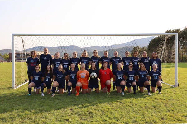 Left to right, Front row: Kayli Stapelfeld, Brittney Love, Lily Mulin, Samantha Martin, Emily Carchia, Teo Holmes, Isabel Atkisson, Olivia Davis, Kali Wooster, Denyce Ruiz, Abby Davis. Back row: Erika Nichols-Frazer, John “Norm” Peterson, Bella Masi, Catherine Plant, Peyton Fairchild, Maddie Power, Ida Eames, Maggie Egan, Matt House, Jenna Pelland, Cecelia Bethel, Ida Eames.