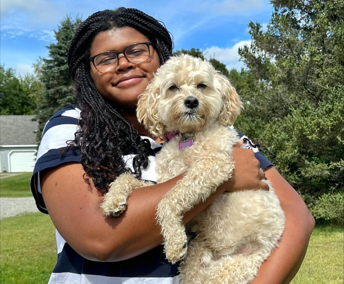 Maya Nasta with a golden-doodle, Lucy